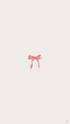 a pink bow is hanging on a white wall