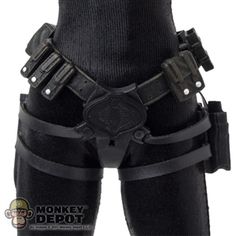 the back view of a man wearing black leather pants and knee pads with metal buckles