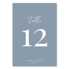 a table number card with the numbers twelve and twelve in white on a blue background