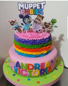 there is a multi layer cake with characters on it