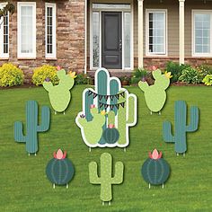 cactus yard decorations in front of a house