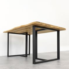 two tables made out of wood and metal