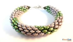 three stranded bracelet with green and white beads on a white background, close up