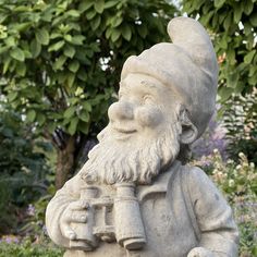 a statue of an old man with a pipe in his hand