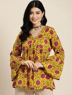 * Floral Printed Pure Cotton Kurti Printed Kurti / Embroidered Short Kurti / Indian Tunic / Summer-Spring Evening Dress / Cotton Tunic Tops Boho Tunic / Hippie Dress / Tribal Print Top * Yellow and pink a-line kurti * Floral printed * V-neck, long, bell sleeves * Machine pure cotton *Fabric:-  Pure Cotton *Wash Care:-  Machine Wash AVAILABLE IN 7 SIZES THEY ARE IN FOLLOWING MEASUREMENTS IN INCHES:- XS:- Bust-34/Waist-28/Length-32 S:- Bust-36/Waist-30/Length-32 M:- Bust-38/Waist-32/Length-32 L:- Bust-40/Waist-34/Length-32 XL:- Bust-42/Waist-36/Length-32 XXL:- Bust-44/Waist-38/Length-32 3XL:- Bust-46/Waist-40/Length-32 NOTE ►►CUSTOMISATION We do customisation ️ ►►TRACKING We give full tracking to our valuable customers, you can track your package any time with tracking code provided by our s Traditional Yellow V-neck Kurta, Spring Yellow Tops With Printed Motifs, Yellow V-neck Traditional Kurta, Yellow Printed Kurta For Spring, Yellow Printed Long Sleeve Kurta, Traditional Printed Yellow Tops, Yellow Printed Long-sleeve Kurta, Bohemian V-neck Top With Printed Motifs, Multicolor Printed Motifs V-neck Blouse