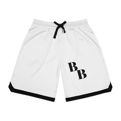 Made with 100% moisture-wicking polyester, these graphic basketball shorts remain lightweight and keep you dry whether it's time to shoot some hoops or enjoy a day out under the hot sun. With a ribbed bottom hem, black detailing and a fully customizable surface, these basketball shorts can become a super stylish addition to any sports fan's clothing roster. .: Material: 100% moisture-wicking polyester .: White interior .: Standard fit .: Two side pockets  .: Black detailing .: Seam thread color Black Athletic Shorts For Basketball In Summer, Summer Basketball Sportswear Bottoms, Summer Sportswear Bottoms For Basketball, Black Athleisure Bottoms For Basketball, Athleisure Moisture-wicking Basketball Shorts, Summer Basketball Athletic Shorts With Built-in Shorts, Athleisure Basketball Shorts With Built-in Shorts, Sporty Summer Basketball Bottoms, Black Sporty Athletic Shorts For Basketball