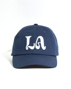 Details Navy blue hat with white LA logo embroidery Chance logo embroidery on back 100% Cotton 6 panel hat Woven eyelets Strap-back closure with metal triglide Navy Blue Hat, White Ferrari, Leon Dore, Spreading Positivity, Best Caps, Stitch Clothes, Event Branding, Classic Hats, Princess Bubblegum