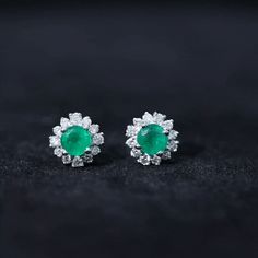 Product Details Introducing the Classic Stud Earrings with Round Shape Emerald, specially crafted for women who appreciate timeless elegance. These exquisite earrings feature a Round Shape emerald gemstone, delicately placed in a prong setting, radiating its natural beauty. Additionally, they are adorned with a halo of round-cut Diamond stones, carefully set in a prong setting, adding a brilliant sparkle to the overall design. This captivating combination of emerald and Diamond creates a stunnin Fine Jewelry Emerald Round Cut Earrings, Emerald Round Cut Fine Earrings, Round Emerald Earrings, Emerald Earrings For May Birthstone, Round Cut, Fine Jewelry Emerald Earrings, Round Shape, Emerald Earrings Studs, Classic Earrings, Emerald Gemstone, Diamond Stone