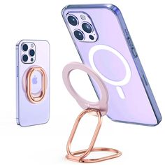 an iphone with a ring holder attached to it next to a phone case and stand