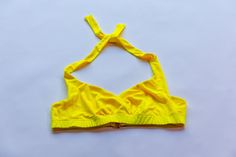 UV Protection The model is wearing a size Small Self 92% PO 8%PU Lining 82% NY 18%PU Rinse with mild soap after swimming Hand to dry in shade to dry naturally Made in NYC CA22107 Halter Neck Top, Mild Soap, Halter Neck, Uv Protection, Soap, Swimming, Yellow, How To Wear