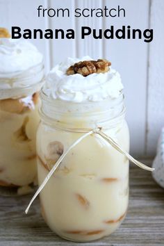 two mason jars filled with banana pudding and topped with whipped cream