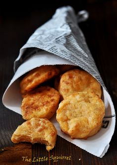 some fried food in a paper bag on a table