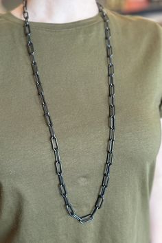 The black finish on this classic paperclip chain gives it a unique flair. Add it to your office look for a touch of sophistication. Lobster Claw Clasp. Length: 18" Black Oval Link Cable Chain Jewelry, Classic Black Chain Link Necklace, Black Jewelry With Oval Link Cable Chain, Black Box Chain Necklace For Formal Occasions, Black Box Chain Necklace For Formal Events, Classic Black Link Chain Necklace, Black Oval Link Chain Necklace As Gift, Black Oval Link Necklace, Everyday Black Chain Link Necklace