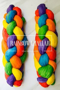 two rainbow colored doughnuts sitting on top of each other with the words rainbow chalk written above them