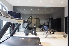 a gym with treadmills and exercise machines