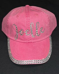 Catch everyone's eye with your awesome rhinestone name in bling baseball hat! This is baseball hat that has your name on it made out of gorgeous rhinestones of various sizes that are placed on it by hand. Not only will you have a gorgeous name if you add these accents you will be extra sparkly.  It's sooo sparkly every one will notice! Please note this listing is only for two rows of rhinestones on the bill.  If you would like three rows or stones on the cap part please contact me for a custom listing. I take special requests.  I use premium high quality glass rhinestones to make your name look fabulous! Just choose what color hat you want and what color stones you would like. Font used is what you see in the photo. If you are interested in a different font please contact me. Hat is pigmen Cheap Rhinestone Cap, Adjustable Baseball Cap With Bling, Adjustable Rhinestone Baseball Cap With Curved Brim, Rhinestone Baseball Cap One Size, Rhinestone Embellished One Size Baseball Cap, Rhinestone Baseball Cap, Rhinestone Hat, Texas Hat, Types Of Hats