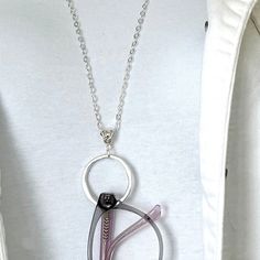 I love the look of this simple, modern, and elegant eyeglass chain necklace. It is made with a high-quality shiny silver plated cable chain and there is a Matte silver organic shape 1 1/4 inch diameter ring to hold your glasses vertically.  A Bali-style silver-plated bail completes the pretty picture. The chain is about 26 inches long and there is a silver-plated lobster claw clasp in the back.    The beauty of this eyeglass necklace lanyard is that is dramatic enough to stand alone as a necklac Modern Glass Glasses Chains, Modern Silver Glasses Chains For Gift, Modern Silver Glasses Chains As Gift, Trendy Everyday Glass Necklaces, Minimalist Everyday Glass Necklace, Trendy Silver Glass Necklace, Everyday Glass Chain Necklaces, Everyday Glass Chain Necklace, Silver Glass Glasses Chains As Gift