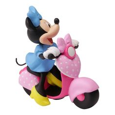 a mickey mouse figurine on a toy motorcycle