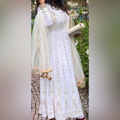 White Anarkhali With Stone Works Full Sleeves Size 38 I Am 5"4 So You Can See The Length Accordingly My Height White Semi-stitched Anarkali Set For Transitional Season, Transitional Semi-stitched White Anarkali Set, Elegant White Anarkali Set With Gota Work, White Formal Salwar Kameez For Transitional Season, White Long Anarkali Set For Wedding, Formal White Salwar Kameez For Transitional Season, White Floor-length Anarkali Set With Dabka Work, Formal White Anarkali Set With Chikankari Embroidery, White Long Anarkali Set Bollywood Style