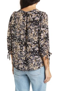 Dainty flowers bloom across a tie-sleeve top in a breezy silhouette. 25" length (size S) V-neck Three-quarter sleeves Slips on over head 100% polyester Machine wash, line dry Made in the USA of imported fabric Model Stats: 5'10" height; 34" bust; 27" waist; 35" hips. Model is wearing size S. Tie Cuff Blouse, Dainty Flowers, Flowers Bloom, Tie Sleeve, Printed Ties, Three Quarter Sleeves, Three Quarter, Nordstrom Rack, Sleeve Top