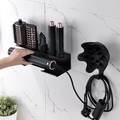 a hair dryer and other items on a wall