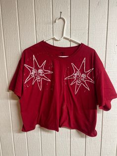 a red crop top with white stars on it