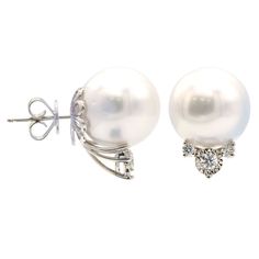 Beautiful freshwater pearls are set atop sparkling diamond accents in these pearl and diamond stud earrings. 18K white gold pairs beautifully next to the impressive 14-15mm white south sea pearls. Featuring butterfly earrings backs to ensure a worry-free wear. Stud earrings are a jewelry wardrobe must-have, you can never have to many! Luxury Platinum Pearl Earrings, Exquisite Diamond Pearl Earrings In Diamond White, Akoya Pearl Diamond Earrings With Diamond Accents For Evening, Diamond White Akoya Pearl Earrings With Diamond Accents, Exquisite Diamond Pearl Earrings With Diamond Accents, Pearl White Diamond Earrings With Diamond Accents, Elegant Silver Platinum Pearl Earrings, Elegant Round Platinum Pearl Earrings, Luxury Pearl Diamond Earrings In Diamond White