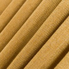 close up view of the texture of a tan fabric