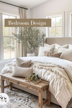 a bed room with a neatly made bed and pillows on the floor next to a window