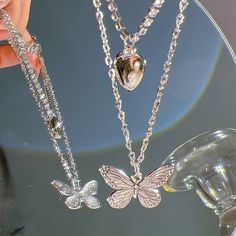 Pearly Butterfly Necklace - Graceful and Whimsical Elegance 🦋💎 🌟 Whimsical Beauty: The Pearly Butterfly Necklace is a graceful and whimsical accessory that combines the elegance of pearls with the charm of butterflies. Its pendant features a delicate butterfly with lustrous pearls, creating a mesmerizing and charming look. 💖 Elegance with a Twist: This necklace celebrates the beauty of nature and pearls, making it a versatile choice for various outfits and occasions. It's adjustable for the Metal Butterfly Necklace For Parties, Metal Butterfly Charm Necklace For Party, Dainty Silver Butterfly Necklace For Party, Butterfly Charm Metal Necklace For Party, Dainty Silver Butterfly Necklace For Wedding, Butterfly Pendant Necklace For Party, Butterfly Charm Pendant Necklace For Party, Silver Butterfly Necklace For Party, Elegant Butterfly Charm Choker Necklace