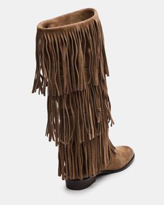 Upgrade your wardrobe with the SPUR fringe boot. These boots feature a fringe detailing that adds a touch of effortless style. Perfect for any occasion, these boots will elevate your look while providing comfort and durability. 1 inch heel height 14.5 inch shaft circumference 15 inch shaft height Suede upper material Synthetic lining Leather sock Synthetic sole Fit tip: If you are in between sizes, size up a half-size Imported Casual Leather Fringe Boots, Leather Fringe Boots For Fall, Casual Suede Fringe Boots, Winter Suede Boots With Tassels, Casual Fringe Boots For Fall, Winter Fringe Ankle Boots, Casual Winter Boots With Fringe, Casual Fringe Winter Boots, Casual Winter Fringe Boots