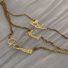 Personalize your style with our Mini Dainty Cuban Name Necklace, crafted from high-quality gold or silver-plated stainless steel. Delicately designed, this necklace features your name elegantly spelled out, adding a touch of personality to any look. The adjustable chain ensures the perfect fit, making it a versatile accessory for any neckline. Whether you're treating yourself or gifting it to someone special, our Custom Dainty Cuban Name Necklace is the perfect way to celebrate individuality and style. Make a statement with a personalized touch that's sure to be cherished for years to come. Stainless Steel 18k Gold, Silver or Rose Gold Plated Waterproof and Tarnish-free Choose your own font style HOW TO ORDER IN 3 EASY STEPS Choose your necklace color and chain length. Chains include a 2 i Elegant Personalized Stainless Steel Chain Necklace, Adjustable Stainless Steel Name Necklaces, Adjustable Stainless Steel Necklaces With Name, Adjustable Stainless Steel Name Necklace, Elegant Name Necklace With Adjustable Chain, Elegant Metal Name Necklace With Adjustable Chain, Stainless Steel Nameplate Necklace With Adjustable Chain, Customized Metal Necklace For Personalized Gift, Customized Metal Necklaces For Personalized Gifts