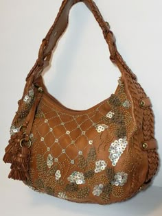 Designer Brown Hobo Bag For Evening, Brown Embellished Luxury Bag, Luxury Brown Embellished Bags, Luxury Embellished Brown Bag, Designer Embellished Leather Shoulder Bag, Party Brown Embellished Shoulder Bag, Brown Embellished Shoulder Bag For Party, Embellished Brown Shoulder Bag For Party, Elegant Embellished Brown Shoulder Bag