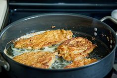 some food is being cooked in a pan on the stove and ready to be eaten