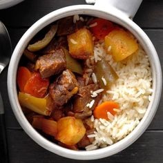 a white bowl filled with rice and meat