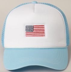 a white and blue hat with an american flag embroidered on the front, along with a light blue brimmed visor