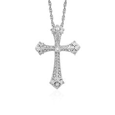 The shine of diamonds adds depth and beauty to this elegant Gothic style cross pendant in sterling silver. The pendant is 18 inches long and closes with a lobster clasp. Pendant Information Chain Length 18 inches Item Width 0.75 inches Item Height 1.00 inches Chain Type Cable Clasp Type Lobster Clasp Setting Type Prongs Rhodium Polish Yes Avaliable Sizes 18 Metal 925 Sterling Silver Diamond Information Min ct. tw. 0.04 Shape Round Average Color J Average Clarity I2 Ring Size Number Of Diamonds T Cheap Silver Rings, Gothic Cross, Silver Ring Designs, Elegant Gothic, Sterling Silver Rings Set, Diamond Cross Pendants, Diamond Cross, Cross Jewelry, Sterling Silver Cross