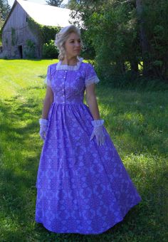 This classic Frontier dress is as flattering as it is accommodating. It is perfect for attending any prairie or western daytime event or for long days working on the homestead. The square neckline frames the face with lovely lace trim. Comfortable short sleeves add comfort and are finished off with the same lace. You will love the look of the button-down bodice. The long skirt that follows will look stunning blowing in the wind during your prairie adventure. Hand or machine wash cold gently; tum Laura Ashley Prairie Dress, Fitted Short Sleeve Prairie Dress For Daywear, Fitted Prairie Dress With Square Neck For Daywear, Fitted Prairie Dress In Pastoral Style, Fitted Prairie Style Summer Dress, Fitted Cotton Prairie Dress, Fitted Prairie Dress, Fitted Short Sleeve Victorian Dress For Summer, Cotton Prairie Dress With Short Sleeves