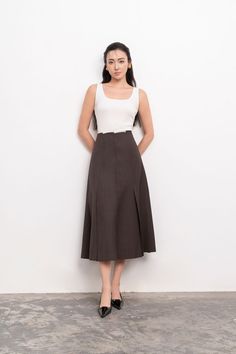 Introducing the midi skirt. Crafted with luxurious linen, this skirt boasts a flattering A-line silhouette and a high waist for a sophisticated and exclusive look. Perfect for all occasions, this skirt combines elegance and comfort effortlessly. Elevate your wardrobe with this must-have piece. *Material: Linen (Beige skirt), Polycotton (Brown skirt) Linen Midi Skirt, Beige Skirt, Mean Blvd, Brown Skirt, Brown Skirts, Linen Skirt, Luxury Linen, Linen Top, Designer Collection