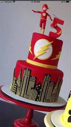 a birthday cake with the flash symbol on it