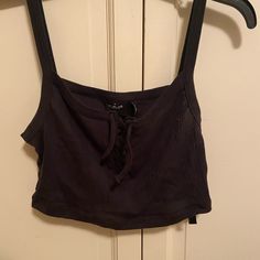 Black Uo Crop Top. Ties In Front, Never Worn. Size L Urban Outfitters Sleeveless Black Crop Top, Urban Outfitters Black Crop Top For Summer, Black Urban Outfitters Crop Top For Summer, Urban Outfitters Fitted Black Tank Top, Urban Outfitters Black Tank Top For Spring, Urban Outfitters Black Casual Crop Top, Urban Outfitters Black Cropped Crop Top, Urban Outfitters Black Cropped Top, Black Cotton Tank Top For Day Out