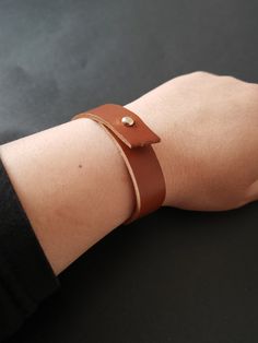 This handmade leather cuff bracelet was created using high quality brown leather. The leather bracelet has a closure based on a strong rivet, for a quick and easy closure. The wrap bracelet would best fi a wrist of 15.5-17 cm This beautiful cuff bracelet would make a wonderful gift for any occasion ! Brown Bracelet, Leather Cuff Bracelet, Bracelet Leather, Women Bracelet, Bracelet Women, Leather Cuffs Bracelet, Unisex Bracelets, Bracelet Cuff, Leather Wrap Bracelet