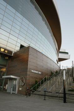 a building with stairs leading up to it and a sign on the side that says warrior's way