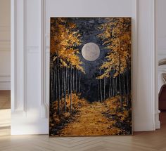 a painting hanging on the wall in front of a fireplace with a full moon above it