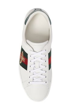 Signature web stripes and bold embroidery bring together two of Gucci's most distinctive house codes on this classic leather sneaker. Contrasting heel tabs are a modern reference to the brand's official colors. Style Name:Gucci New Ace Sneaker (Men). Style Number: 5415061. Gucci Low-top Luxury Sneakers, Luxury Gucci Sneakers With White Sole, Gucci Luxury Sneakers With White Sole, Gucci Luxury Sneakers With Branded Insole, Luxury Low-top Gucci Sneakers, Gucci Luxury Sneakers With Contrast Sole, Luxury Gucci Sneakers, Sporty Gucci Sneakers With Contrast Sole, Designer High-top Lace-up Sneakers With Embroidered Logo