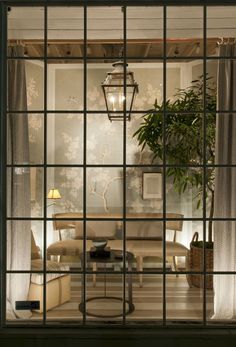 an open window shows a living room and dining area