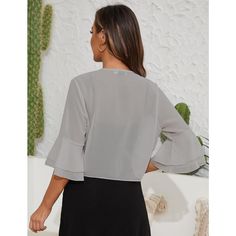 Add a layer of elegance to your wardrobe with our Women's Mesh Cardigan. This lightweight, open-front shrug features ruffle sleeves that offer a charming touch, making it perfect for layering over your favorite outfits. The semi-sheer fabric adds a hint of allure, allowing your look to shine through while keeping you comfortable in warmer weather. Crafted from a blend of 95% polyester and 5% spandex, this cropped cardigan provides a soft and breathable feel, making it the ideal cover-up for the Elegant Gray Cardigan For Layering, Elegant Gray Tops For Layering, Elegant Gray Summer Blouse, Elegant V-neck Ruffle Cardigan, Shoulder Cardigan, Chiffon Cardigan, Mesh Cardigan, Drop Shoulder Cardigan, Halloween Long Sleeve