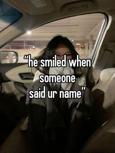 a person sitting in a car with the words he smiled when someone said ur name