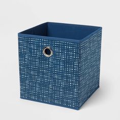 a blue basket with a ring on the front and bottom, sitting against a white background