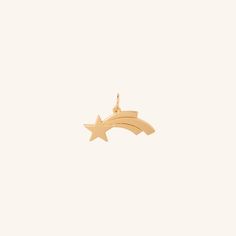 Make a wish or give a wish. The Shooting Star charm captures the eye with its distinctive shape and symbolic meaning Pair with our Cable chain or Flow necklaces, wear solo or complement with other ela charms. - Coated in 18K gold (2.5 microns) - Brass Base - Length: 20 mm - Width: 5 mm - Bail Size: 5 mm JEWELRY CARE As with all metals, special care must be taken to ensure they do not scratch or tarnish over time. Follow these simple steps to keep your pieces looking their best:Avoid direct contact when applying cosmetics, perfumes, sprays, creams and oils. Store jewelry in a clean, dry place away from natural sunlight, humidity and heat. Each piece should be stored individually in an air-tight pouch (especially sterling silver and gold vermeil to prevent oxidation, tarnishing and scratchin Tarnish Remover, Store Jewelry, Shooting Star, Natural Sunlight, Shooting Stars, Star Charms, Make A Wish, The Eye, Cable Chain